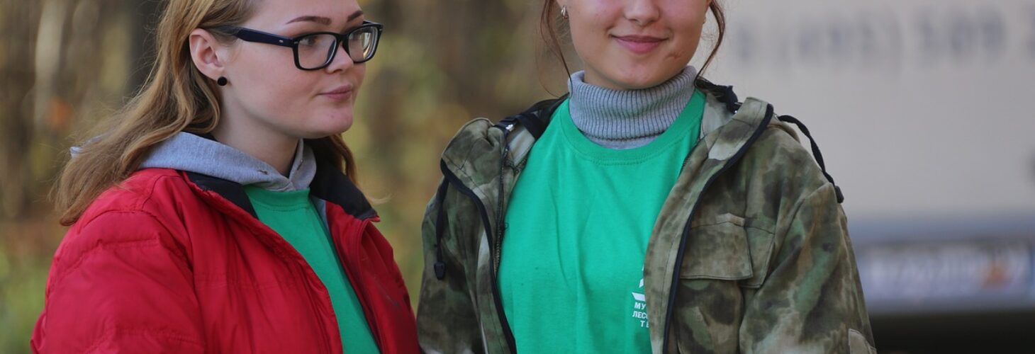 Two young people looking at a camera.