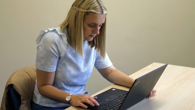 woman looking at laptop